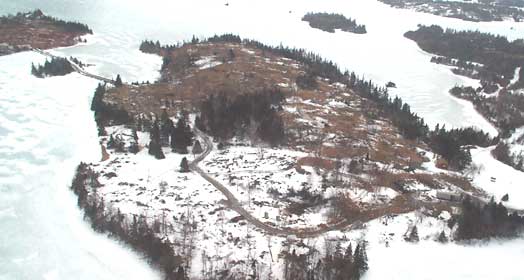 historical aerial photograph highlighting the extensive clean up after Hurricane Juan. The photo shows a significant amount of open space with snow on the ground.