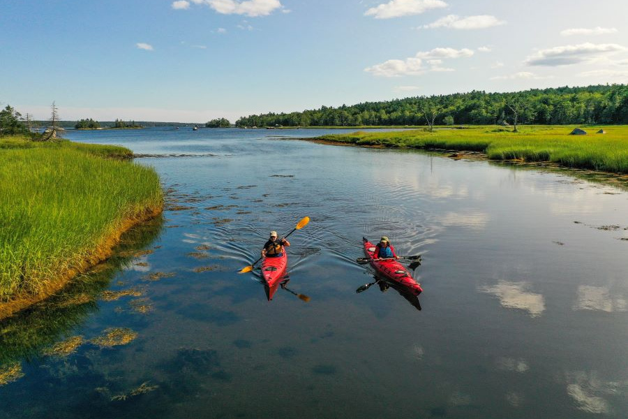 Two people kayaking in Shelburne Harbour at The Islands park. 