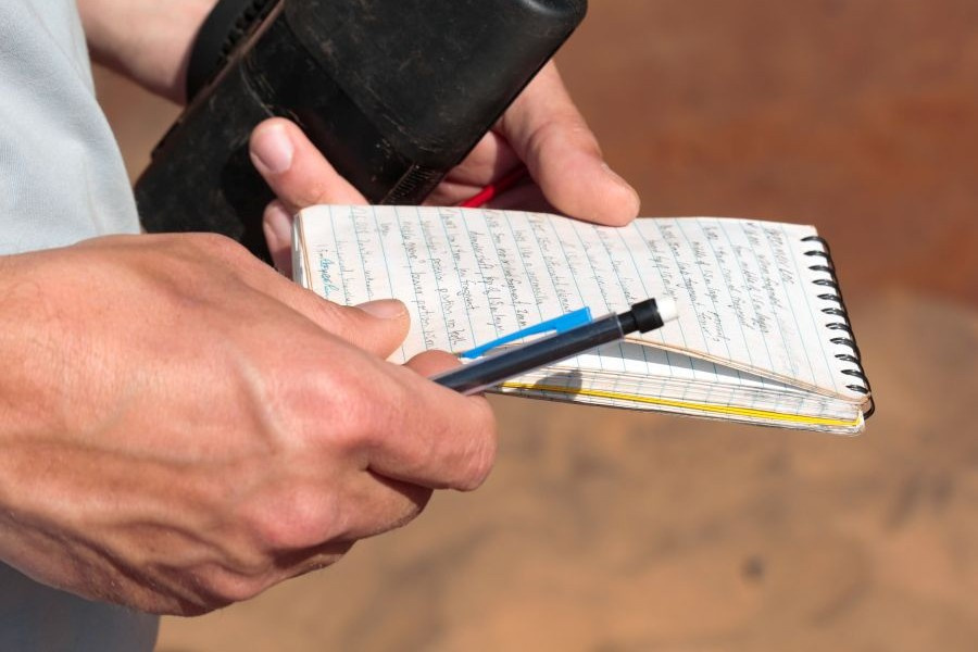 a person holding a notepad