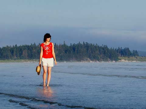 person wading at Sand Hills Beach