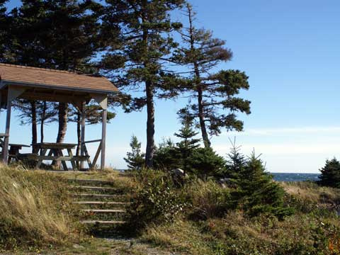 Staircase leading to a covered picnic table